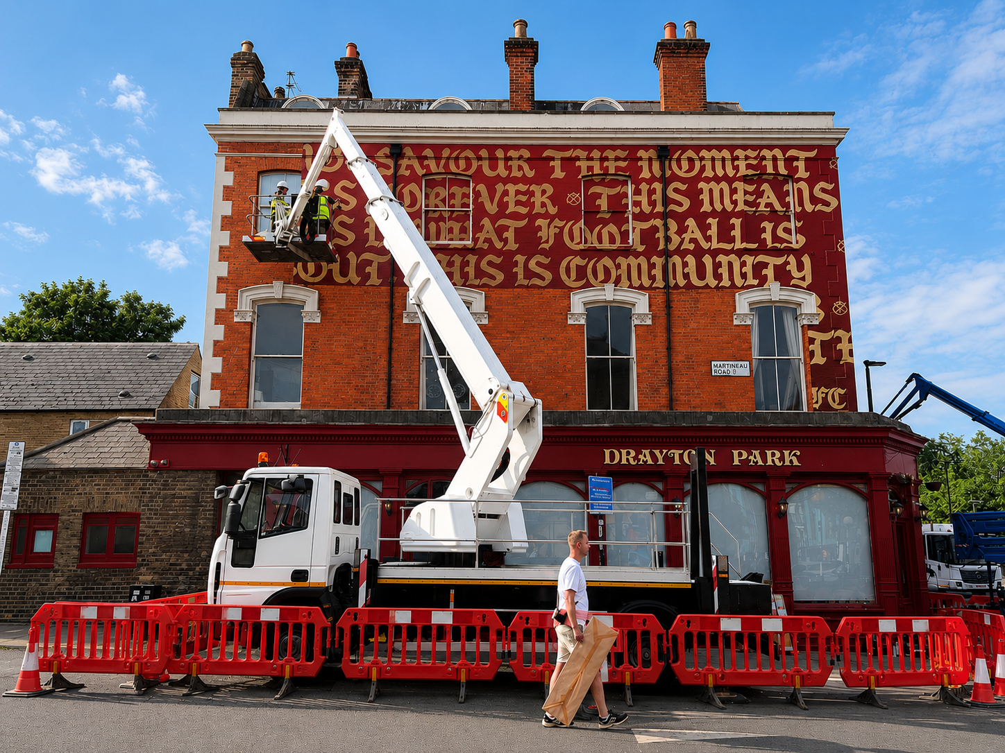 Arsenal Parade Graphics & Flag Installations Two cherry pickers helping transform North London for the celebrations