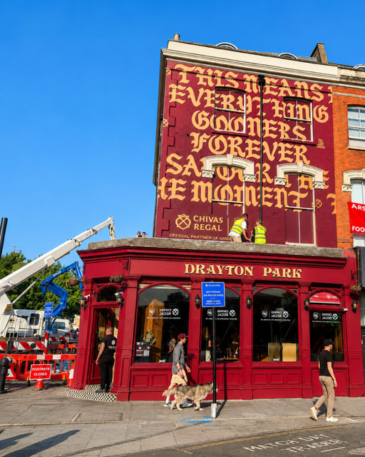 Arsenal Parade Graphics & Flag Installations Two cherry pickers helping transform North London for the celebrations