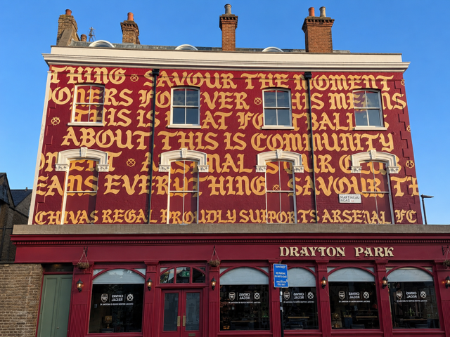 Arsenal Parade Graphics & Flag Installations Two cherry pickers helping transform North London for the celebrations