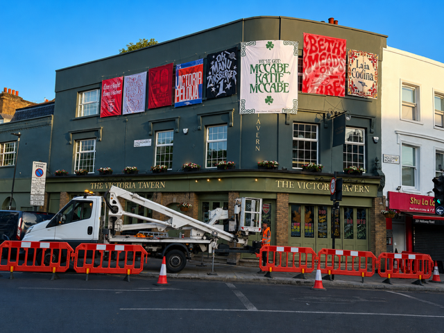 Arsenal Parade Graphics & Flag Installations Two cherry pickers helping transform North London for the celebrations